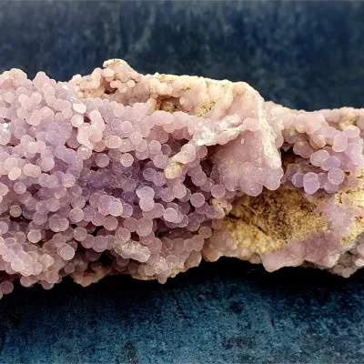 Natural purple grape agate crystal specimen with sparkling botryoidal grape-like clusters.