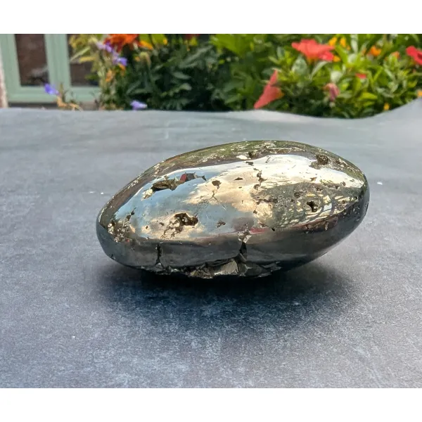Polished iron pyrites hand held