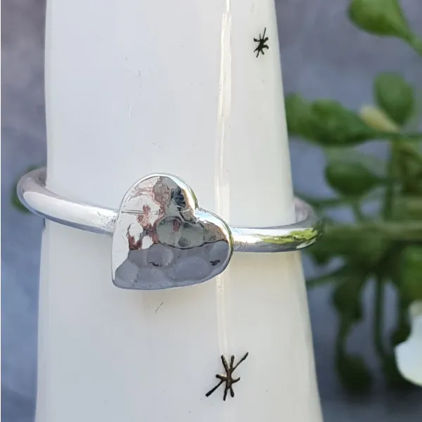 heart charm ring young woman
